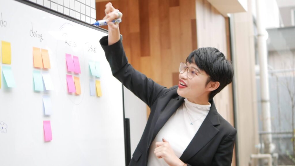 Ms. Vy with whiteboard